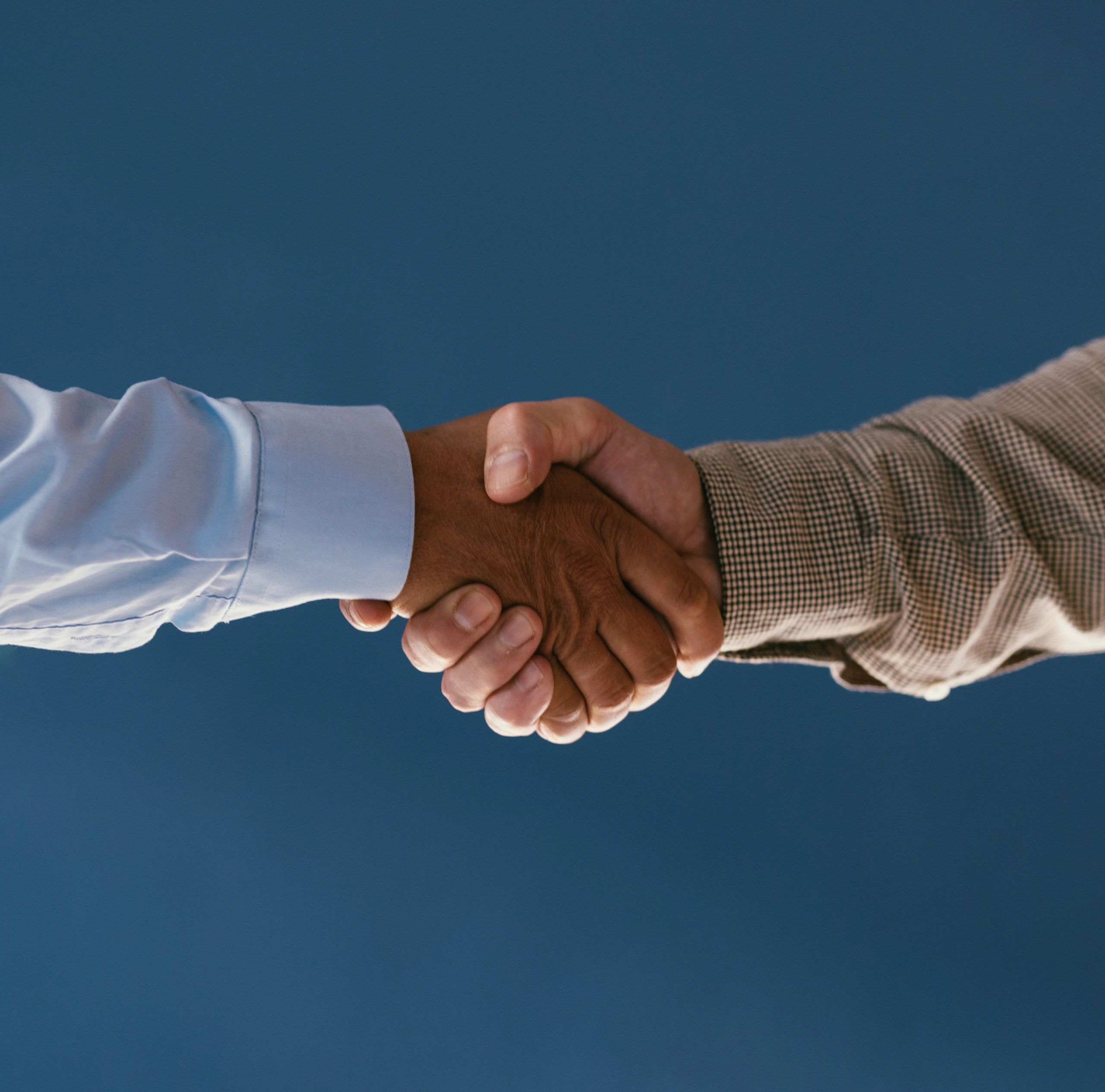Business handshake representing professional relationships and communications